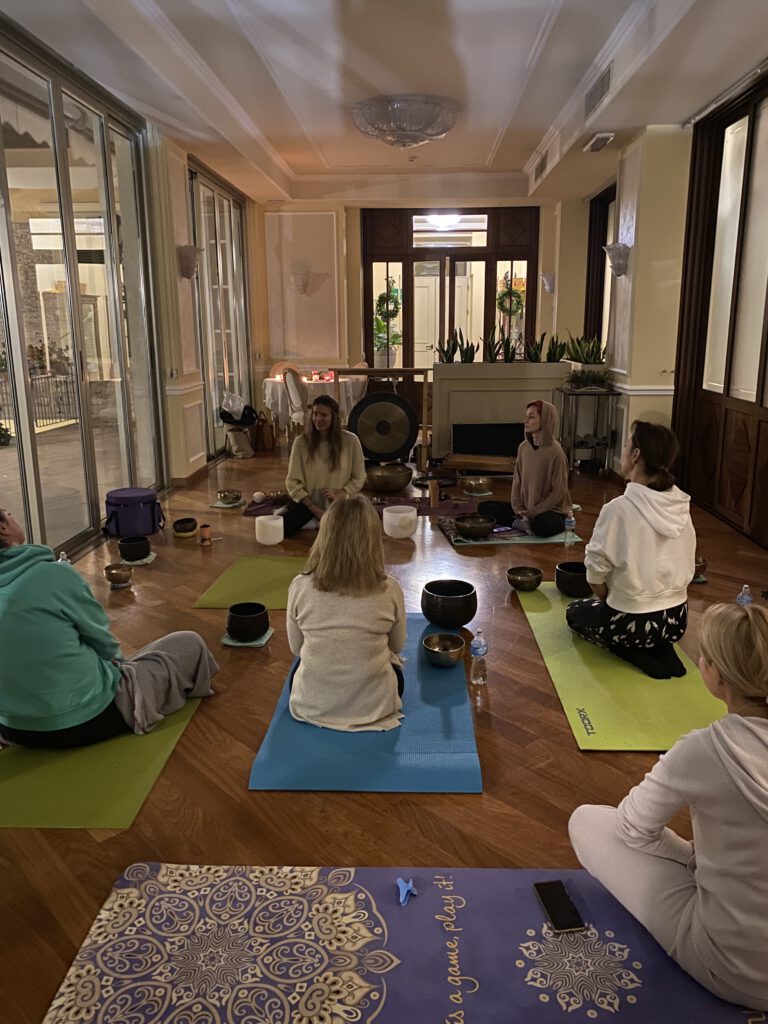 Group sound healing session in a studio